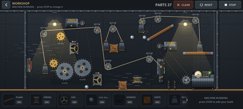 Gameplay screenshot: a machine running in Workshop mode, with motors, large gears, belts, pulleys, weights and two lit lamps.
